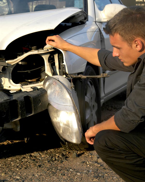 Damage inspection on a wrecked vehicle